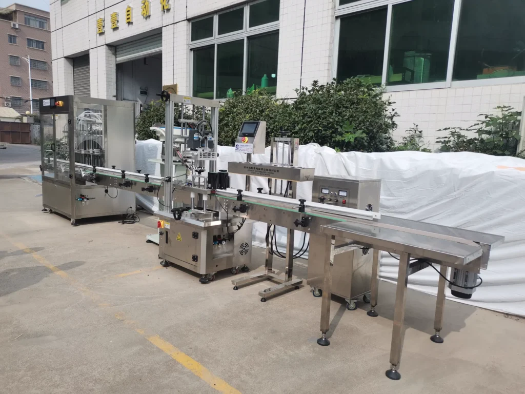 LEKA complete liquid bottle filling, capping, sealing and conveying line during factory testing