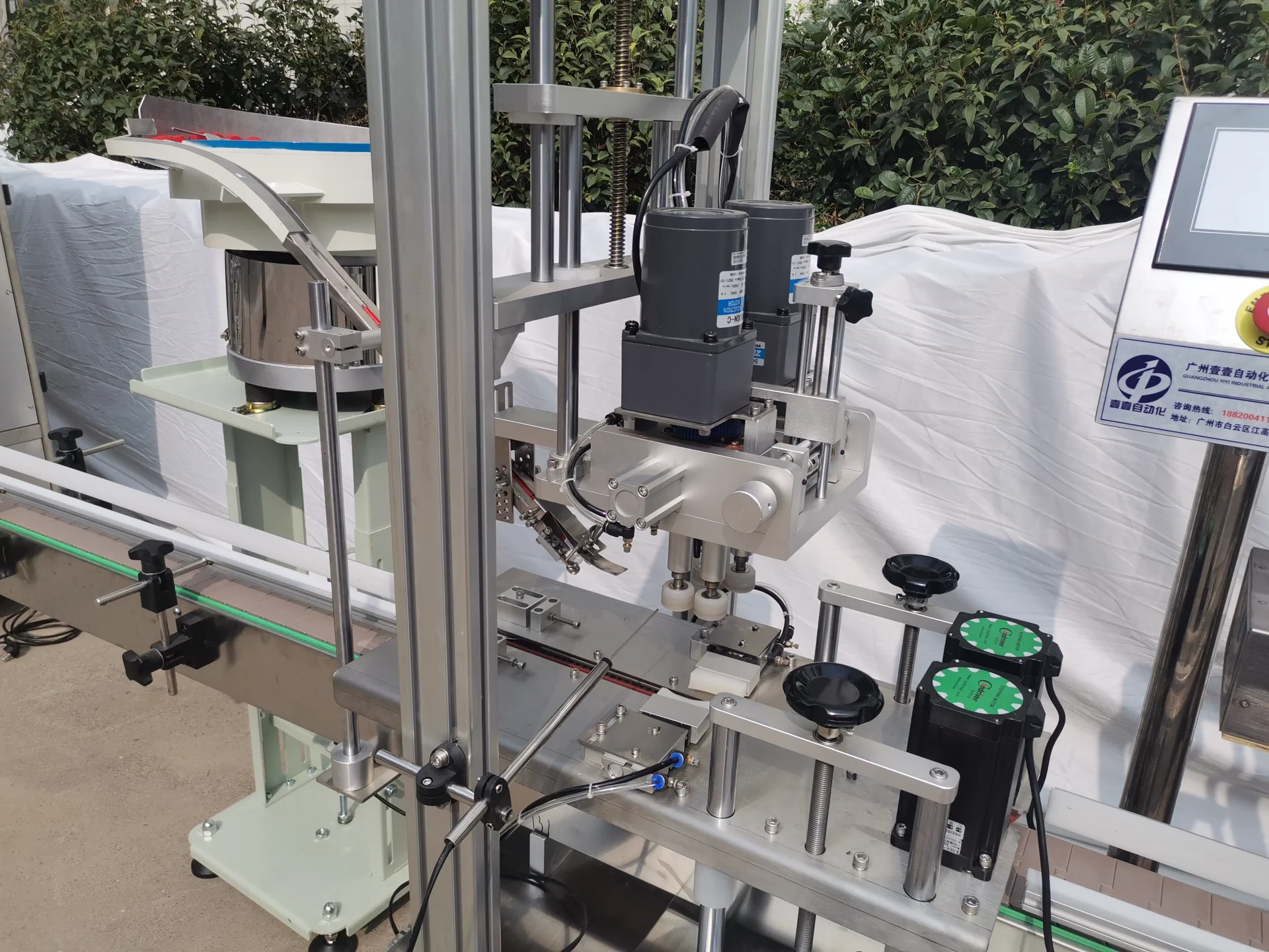 LEKA automatic bottle capping station with cap feeding and placement detail