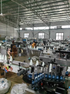 LEKA FLWS customer production site showing liquid bottle filling capping and labeling workflow