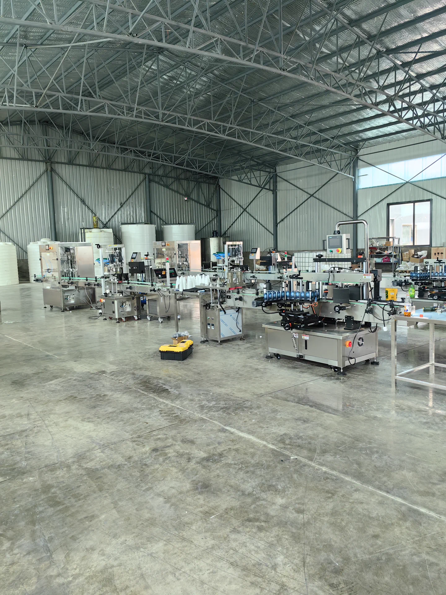 Household chemical filling line with filling capping labeling and conveyor system