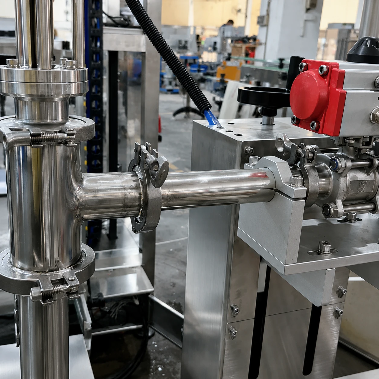 Stainless pipe and shutoff valve on a weighing filling line
