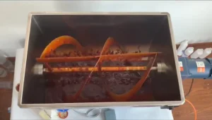 Chunky sauce moving under hopper agitation during a semi-automatic filling trial