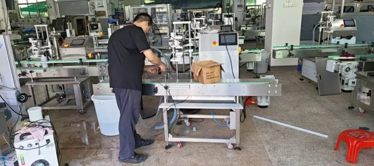 Technician adjusting a bottle conveyor on the LEKA assembly floor