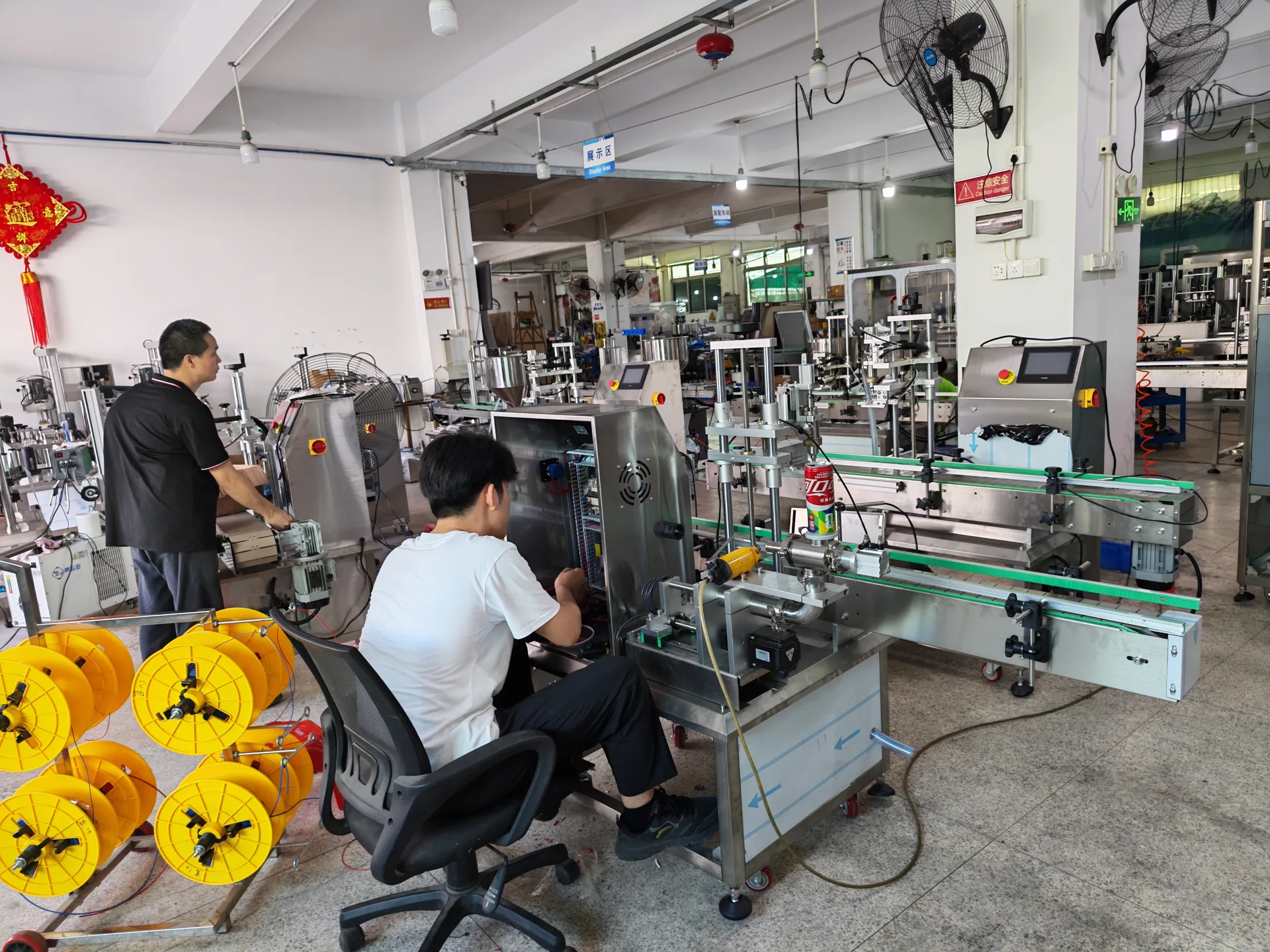 LEKA Pack Line factory floor with technicians assembling connected packaging equipment