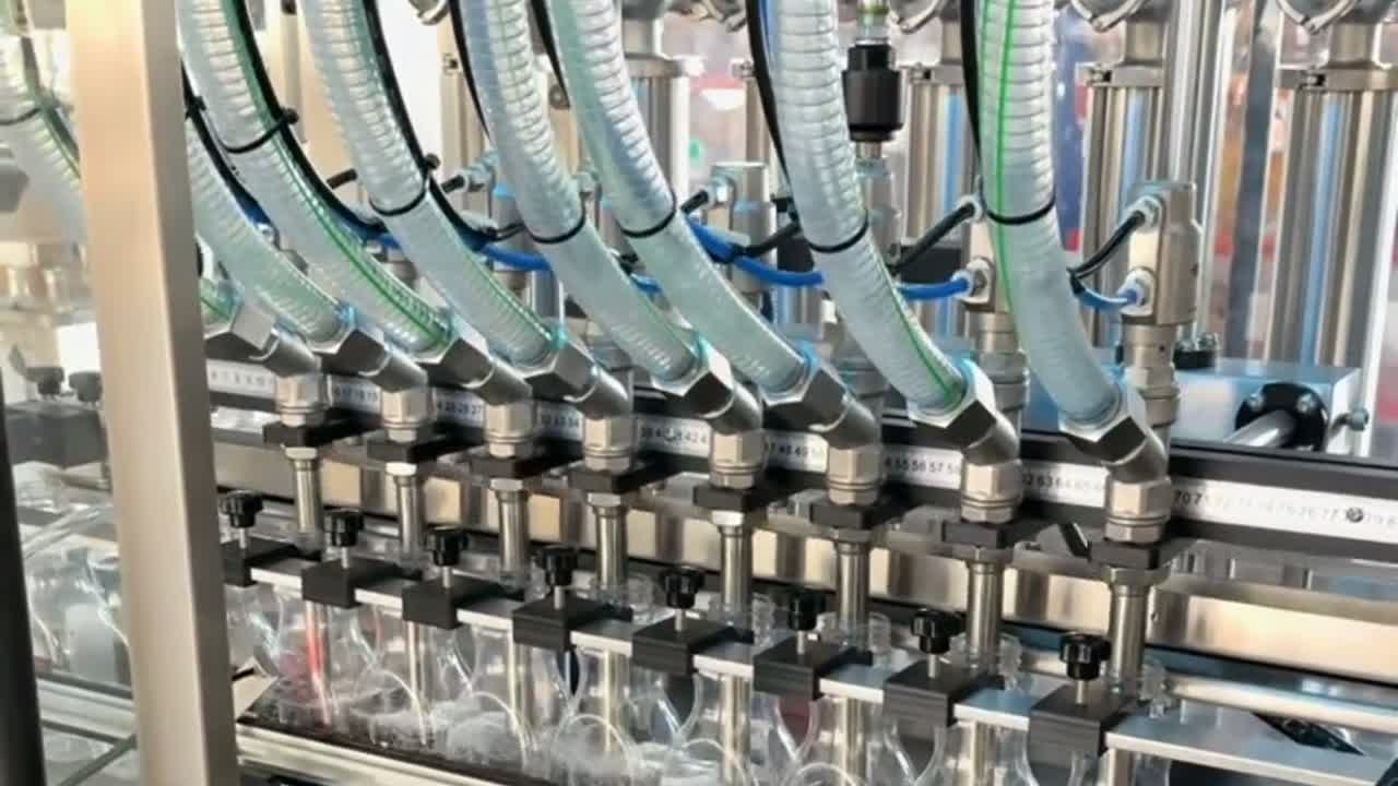 Filling nozzles above bottle necks on the lubricant packaging line